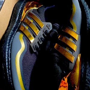 these are rare adisa shoes black and gold